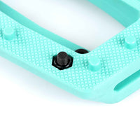 Turquoise Teal Eclat Contra BMX pedal with black pins on a white background