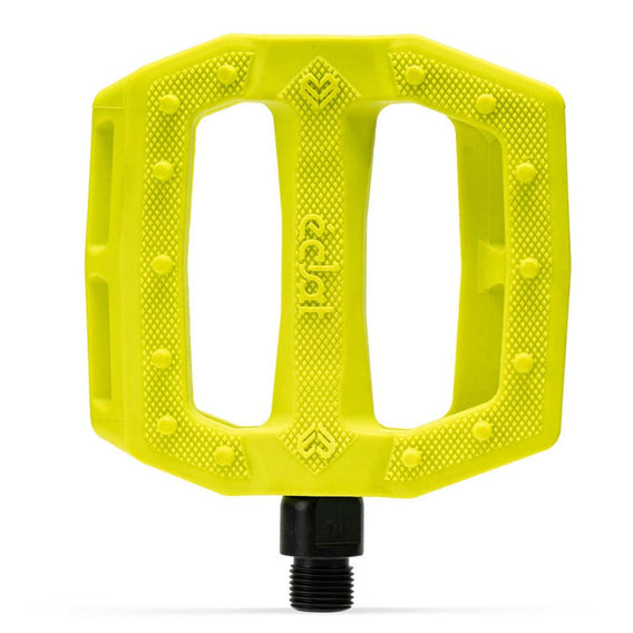 Yellow bicycle pedal with black axle on a white background