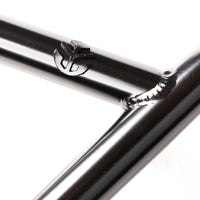 Close up photo of the cross bar of the Federal Dan Lacey signature handlebars showing the inverted Federal logo pronounced from the tube.