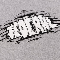 Close up photo of the black and white print on the Federal Bricks t-shirt