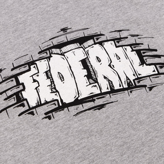 Close up photo of the black and white print on the Federal Bricks t-shirt