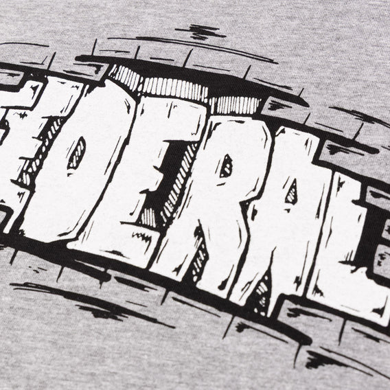 Close up photo showing the logo printed on the heather grey Federal Bricks t-shirt