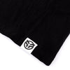 Close up of the Federal embroidered tag logo that is sewn onto the hem of the t-shirt