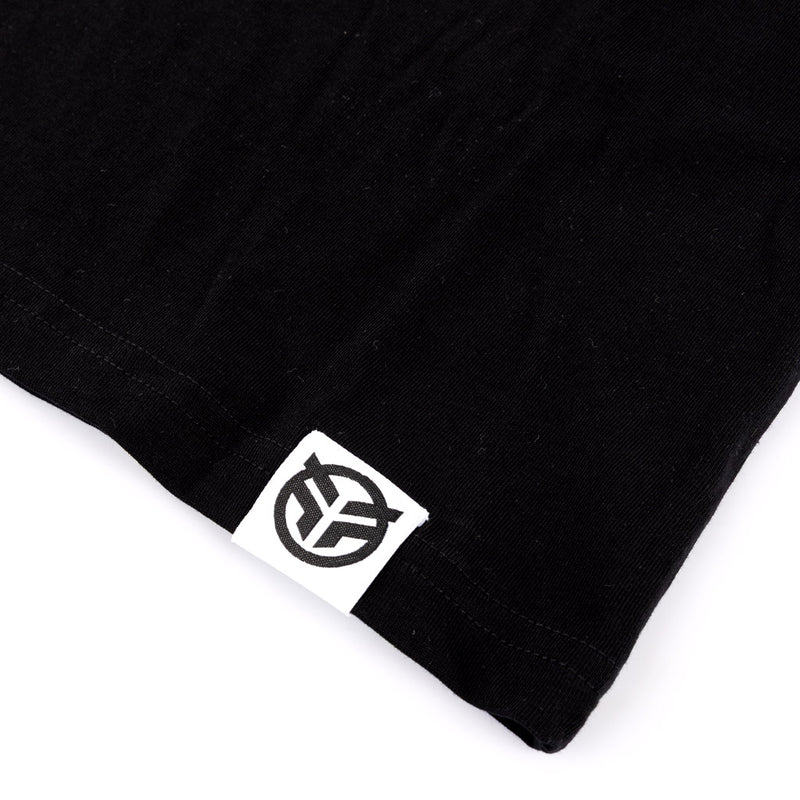 Close up of the Federal embroidered tag logo that is sewn onto the hem of the t-shirt