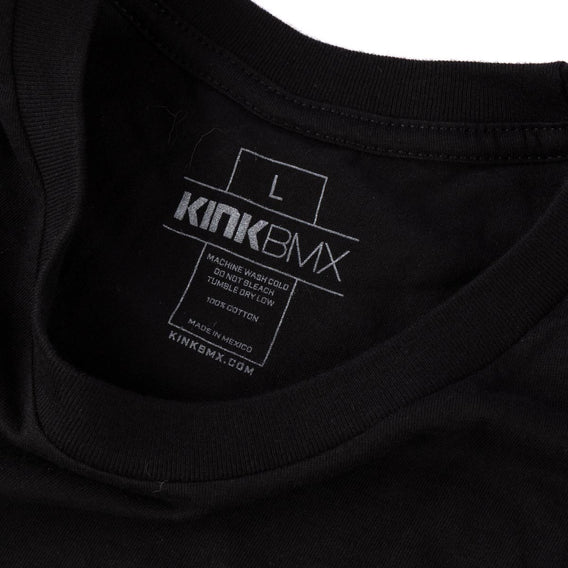 Black t-shirt with Kink BMX neck print label on a white background