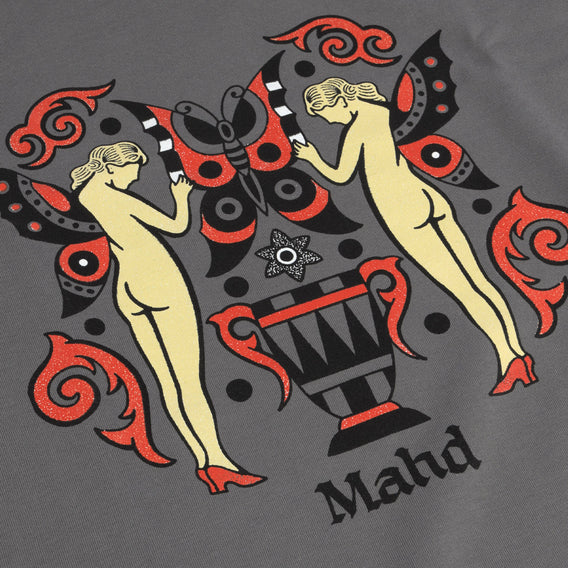 Decorative design with two nude figures, a butterfly, and an urn on a gray background.