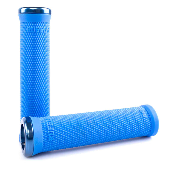 Pair of blue ODI Ruffian Lock-on handlebar grips on a white background