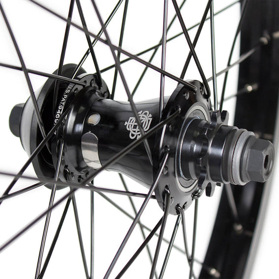 Close-up of a bicycle hub with visible branding on a white background