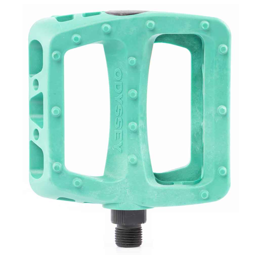 Teal BMX bicycle pedal with 'Odyssey' branding on a white background