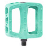 Teal BMX bicycle pedal with 'Odyssey' branding on a white background