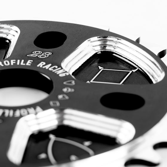 Closeup view of recessed section of Profile Racing Blackjack sprocket in 28 tooth photographed on a white background