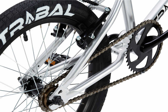 Tribal Nomad 18" BMX Silver, close up of rear tyre and brake photographed on a white background