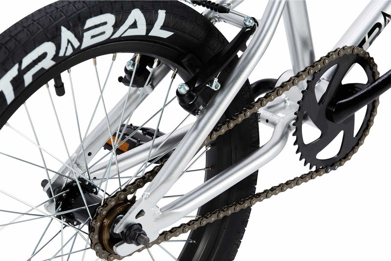 Tribal Nomad 18" BMX Silver, close up of rear tyre and brake photographed on a white background