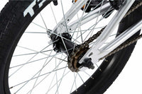 Tribal Nomad 18" BMX in Silver, close up of rear tyre and hub photographed on a white background