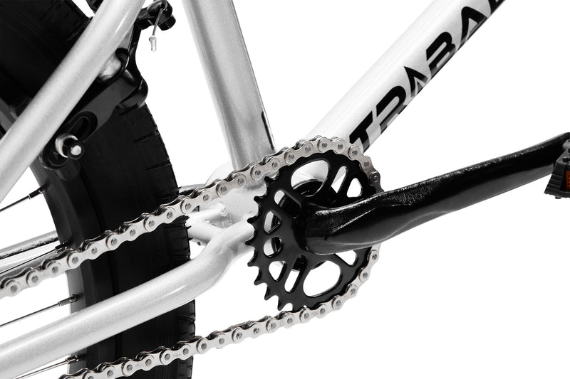 Tribal Spear Silver BMX, close up of rear sprocket and cranks on a white background
