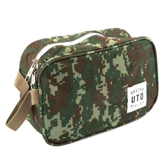 Camouflage-patterned toiletry bag with a visible brand label on a white background