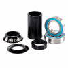 Bicycle headset components including black cups and bearings on a white background