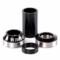 Set of black and silver bicycle bearings on a white background