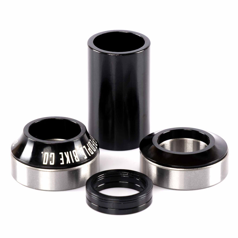 Set of black and silver bicycle bearings on a white background