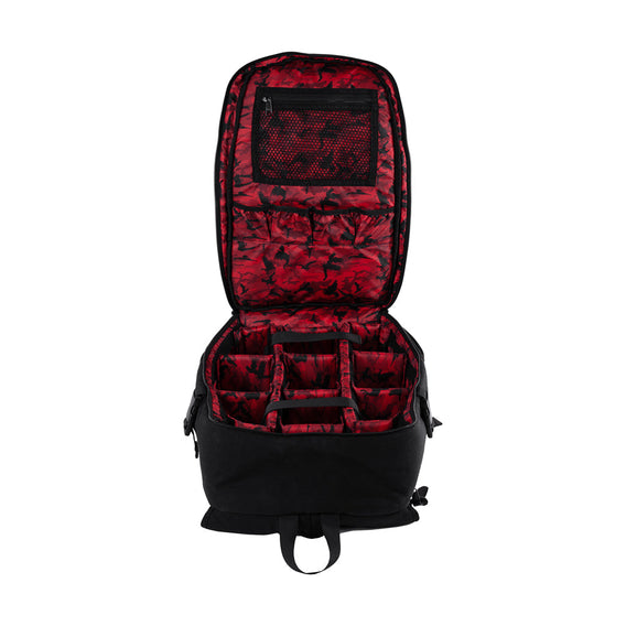 A black camera backpack with multiple compartments and straps, featuring the Shadow BMX brand logo.
