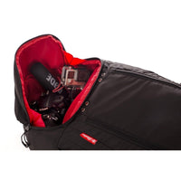 A black Shadow Session V2 Backpack with multiple compartments and padding, designed for biking and travel.