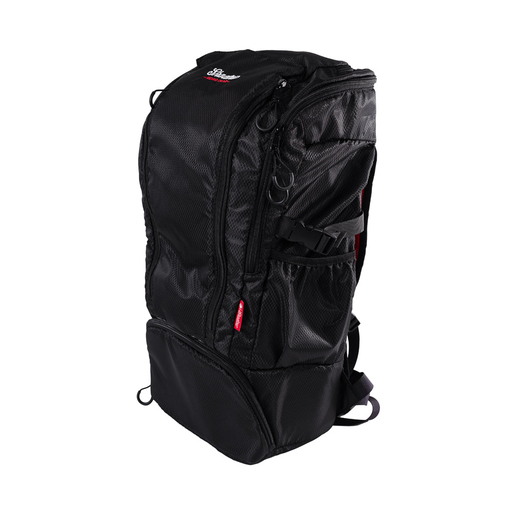 A black Shadow Session V2 Backpack with multiple compartments and padding, designed for biking and travel.
